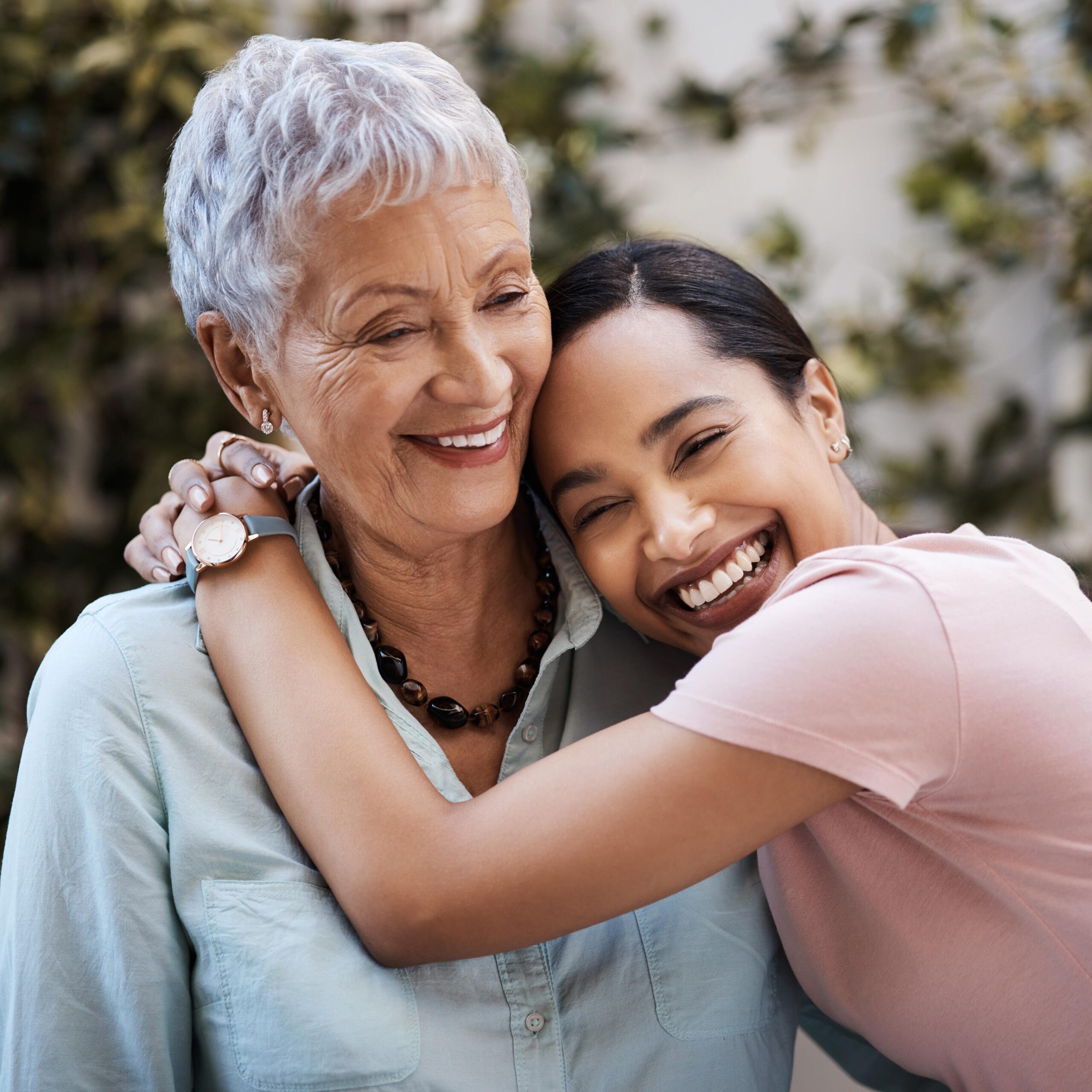 Daughter hugging mother